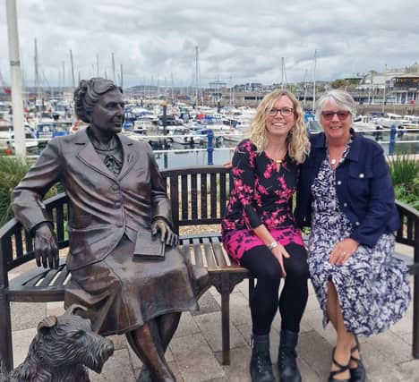 ERBID Company's CEO Carolyn Custerson and Chalk and Ward director Gemma Boss by the Agatha Christie statue on Torquay harbourside