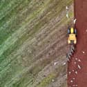 A farmer ploughs the fields at Farringdon near Exeter. Image by Red Zeppelin
