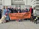 Marilyn Lant and guide dog Milly join floating bus stop campaigners to present petition in Downing Street 