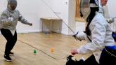 Beginners Audrey and Sally fencing Sabre. Pic from Jason P Ball