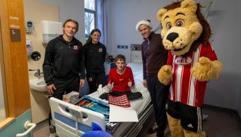 Exeter City FC players bring Christmas cheer to young patients at Royal Devon Hospital