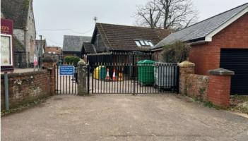 The existing main gates at Lady Seward Church of England Primary School in Clyst St George (Image courtesy: Noved Consulting).