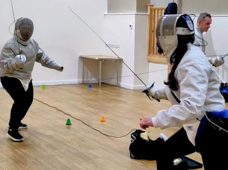 Beginners Audrey and Sally fencing Sabre. Pic from Jason P Ball