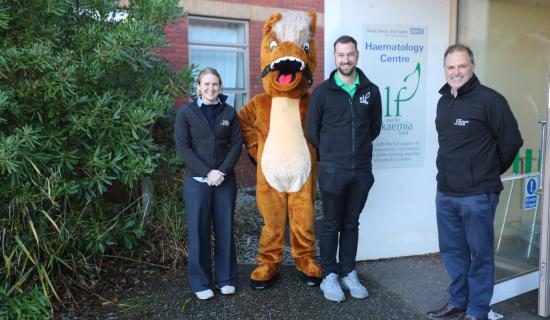 Exeter Racecourse mascot delivers Christmas gifts to children&rsquo;s ward after charity raceday