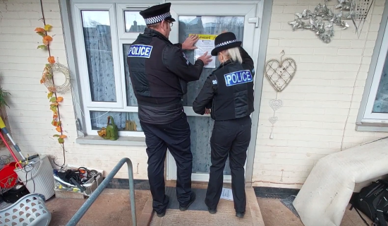Police officers issuing the closure order