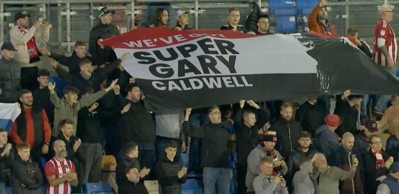 Fans show their support for the manager