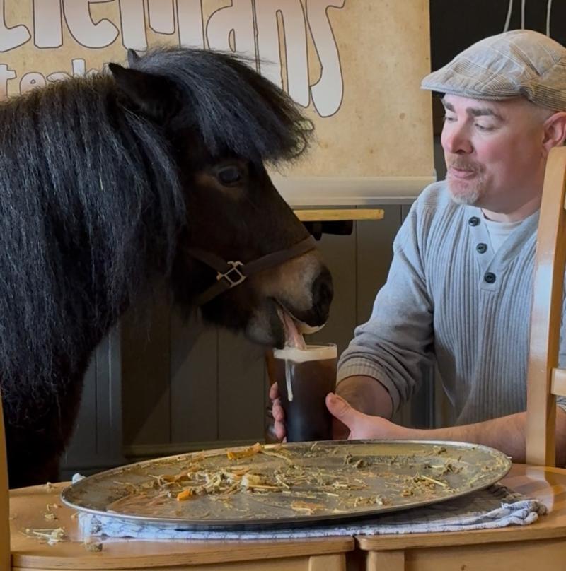 Patrick enjoys a pint of Guinness with owner Kirk Petrakis
