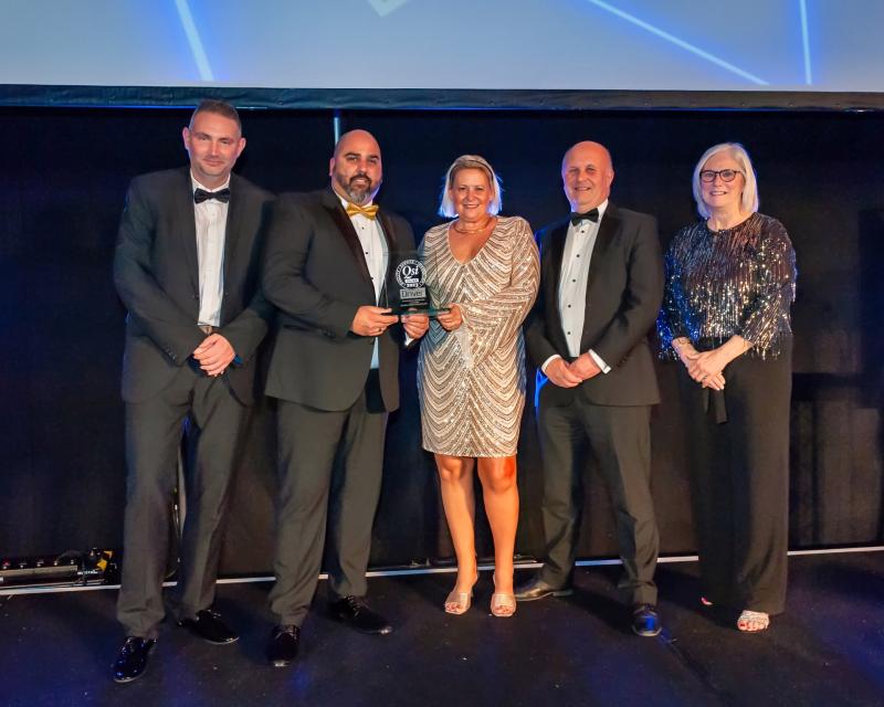 Hilton Ames owners Andy (second right) and Paul (second left) with one of their many awards