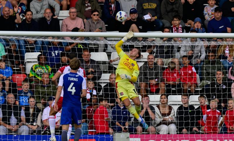 Exeter goalkeeper Joe Whitworth makes save at Stevenage. Pic from PPAUK