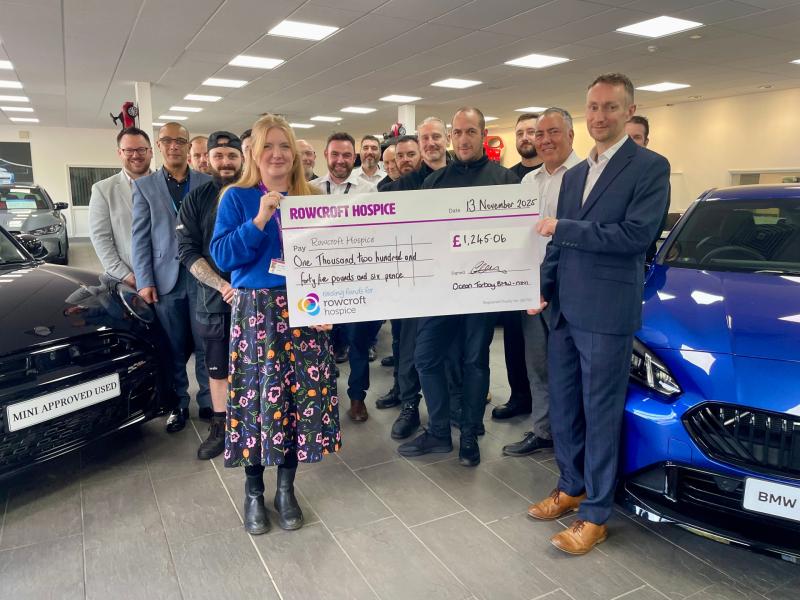 head of business Gareth Watton and the Ocean BMW team with the Rowcroft cheque