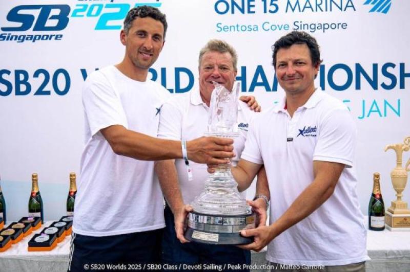 John Pollard (middle) holding another trophy