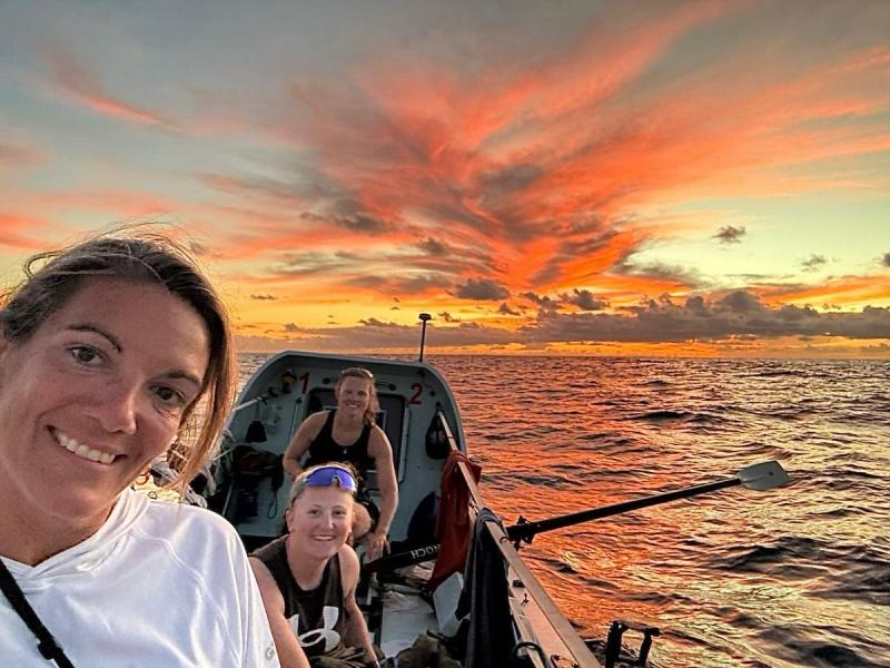 'Row with the Flow' with a magnificent sunset. (l to r) Clare O'Reilly, Rosie Tong, Melissa Jarman.